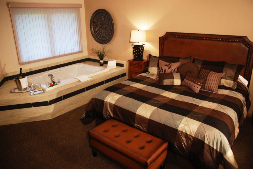 One king size bed, livingroom with one queen size sofa sleeper, 2 cable televisions, two sided fireplace, kitchenette, dining area, full bath, double whirlpool and semi-private patio/deck.