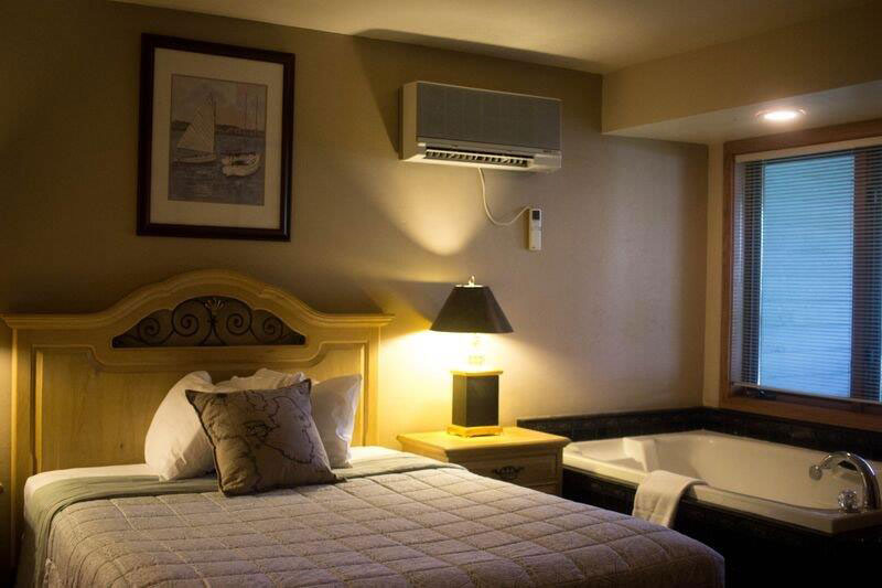 One queen size bed, living room with one queen size sofa sleeper, 2 cable televisions, two-sided gas fireplace, double whirlpool bath (in bedroom), sitting area and semi private patio/deck.